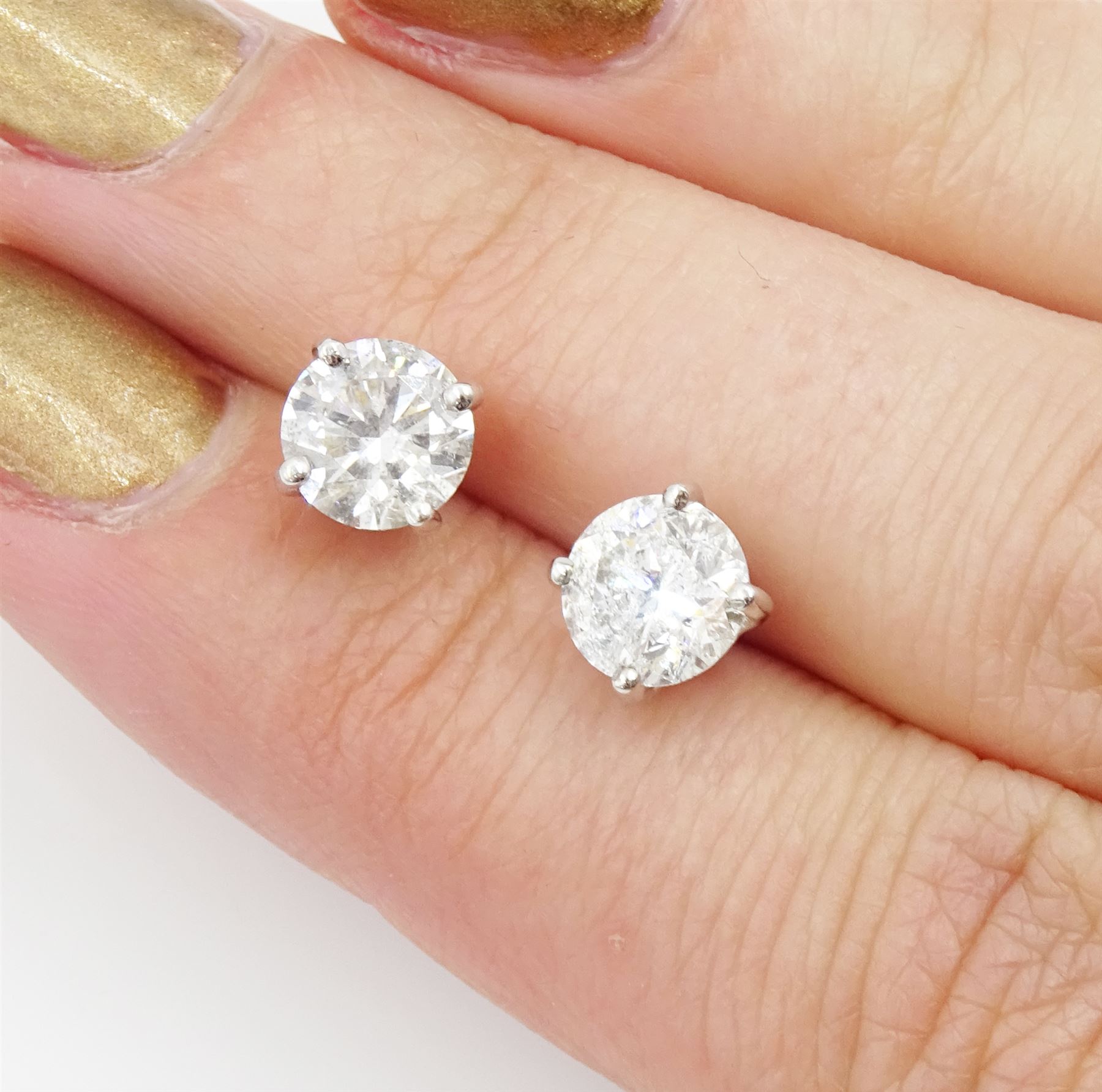 Pair of 18ct white gold round brilliant cut diamond stud earrings, total diamond weight 2.00 carat, with World Gemological Institute Report