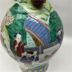 20th century Chinese Famille Rose vase, of baluster form with flared lobed rim and twin figural handles, decorated in polychrome enamel with figures dancing and playing instruments within a garden setting, H42cm