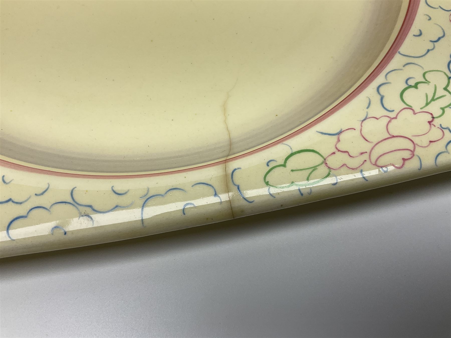 Clarice Cliff Biarritz part dinner set, circa 1930, for Royal Staffordshire, of rectangular form, decorated with bluebells, to include one serving plate, six dinner plates, three side plates, etc, printed mark beneath with reg no 784849 (17)