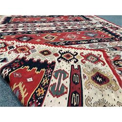 Two Moroccan flat woven kilim rugs, each with horizontal panels and decorated with stylised geometric motifs, 231cm x 170cm & 202cm x 136cm