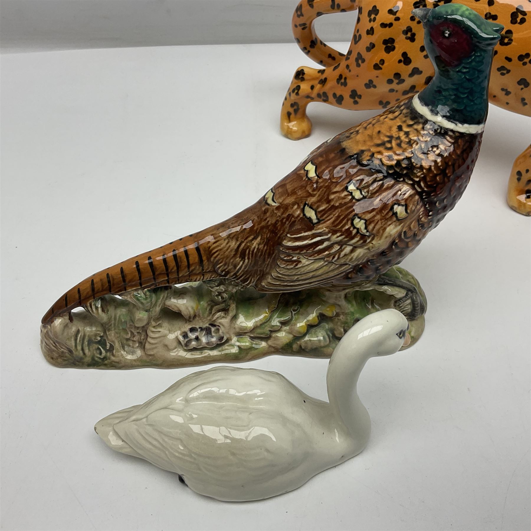 Group of Beswick figures to include leopard no 1082, rabbits, swan, pheasant no 1226 etc, all with marks beneath