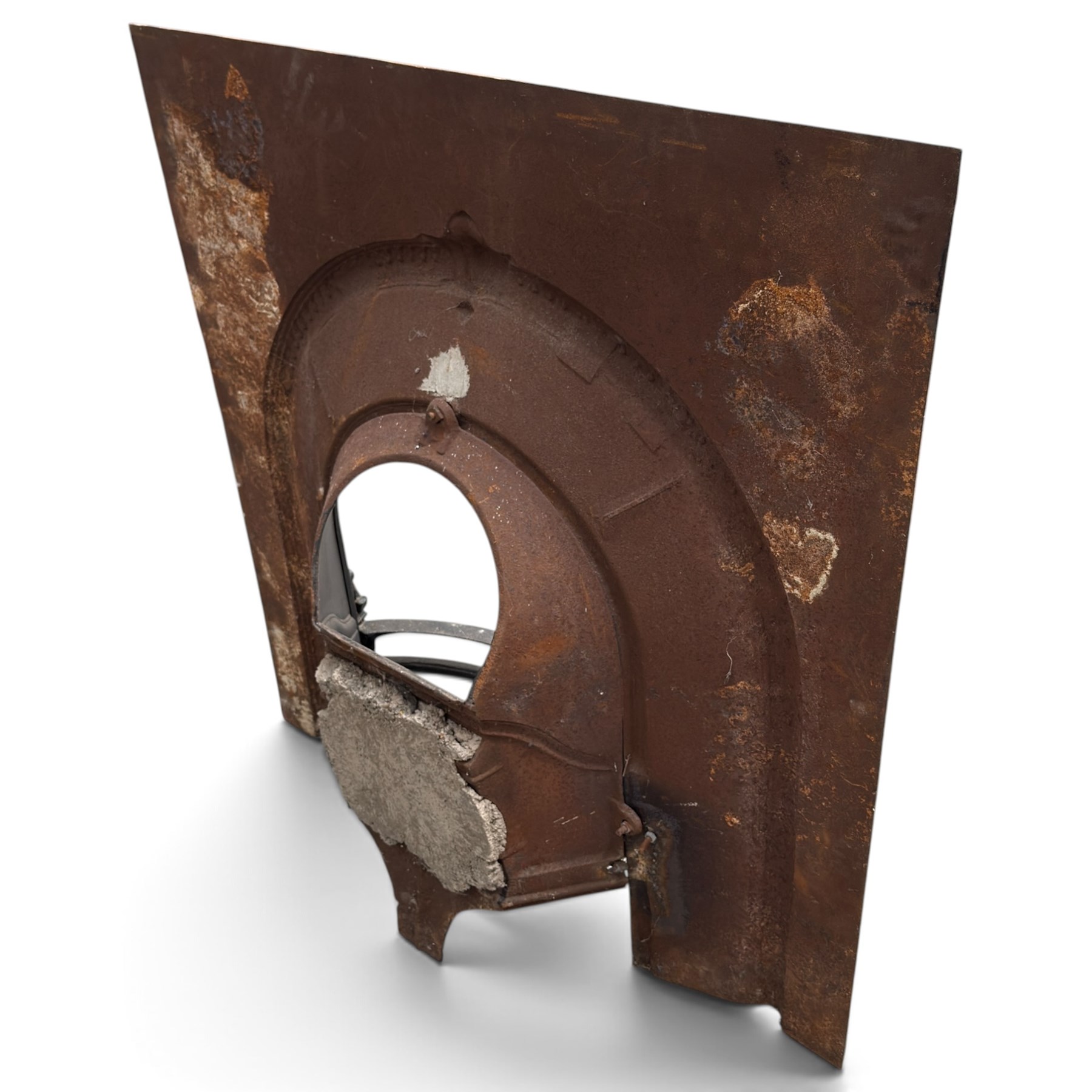 Late Victorian black-painted cast iron fireplace, the arched surround with anthemion cartouche and guilloche-moulded border, enclosing a bow-front fire basket with finialled standards, railed front and leaf-cast apron, with sheet-metal backplate