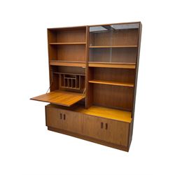 G-Plan - mid-20th century teak modular wall cabinet, fitted with shelves, display cabinet, fall front compartment and two double cupboards