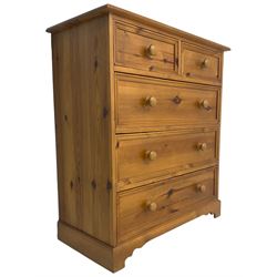 Solid waxed pine chest, fitted with two short and thee long drawers on plinth base