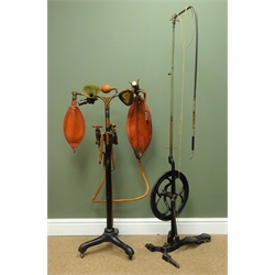  1890s Dentist cast iron treadle Drill with shaped foot pedal, spoked wheel and adjustable tool & an A & T Ltd. of Edinburgh Dentists anaesthetic machine with oxydised metal two branch column with masks and bags, on adjustable tripod stand with castors, (2)  