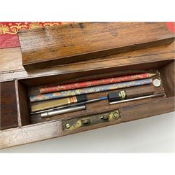 19th century burr yew wood tea caddy, of sarcophagus form, with strung details and brass mounts, the interior split into three compartments, upon four brass bun feet, together with an oak and brass bound writing slope, with red leather interior with gilt detailing, largest H16cm, W40cm