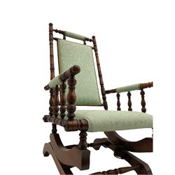 Early 20th century walnut framed American rocking chair, upholstered seat, back and arms