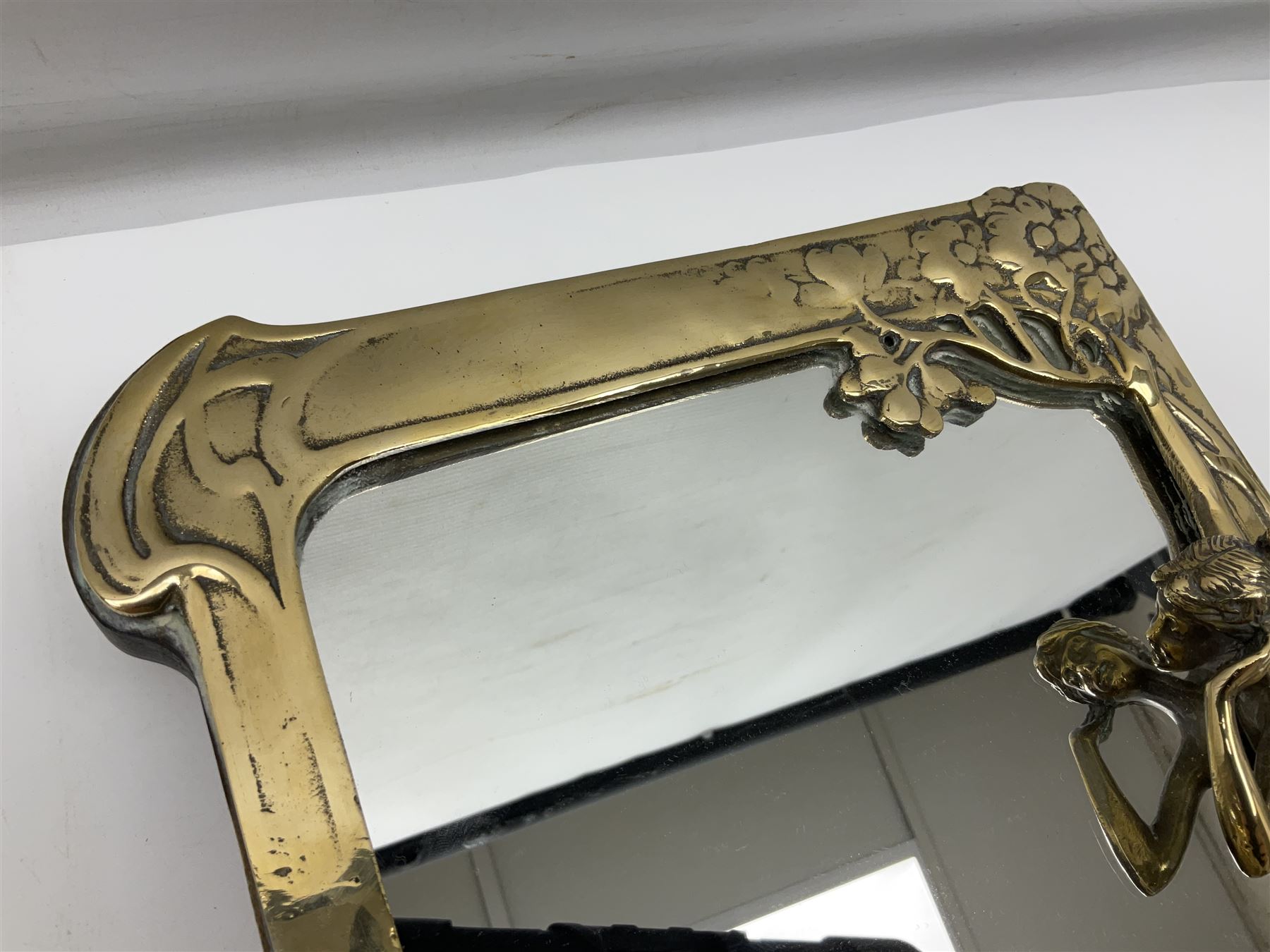 Art Nouveau style mirror in the manner of WMF, decorated with a female figure and floral motifs, the easel support verso with spurious WMF, H35cm