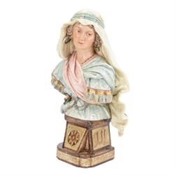 Pair of 19th century German majolica busts, modelled after biblical figures, as a male and female figure in Eastern dress, upon a plinth detailed with script, impressed marks verso 'Gesetz Geschützt' , H37cm