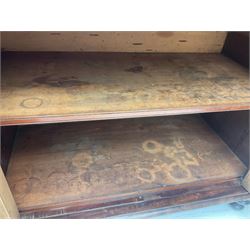 Early 19th century figured mahogany bureau bookcase, projecting splay moulded cornice over three adjustable shelves enclosed by two glazed doors, fall front revealing pigeonholes, cupboard and drawers, pull-out strays with scroll carved terminals, double cupboard with two panelled doors, on turned feet 
