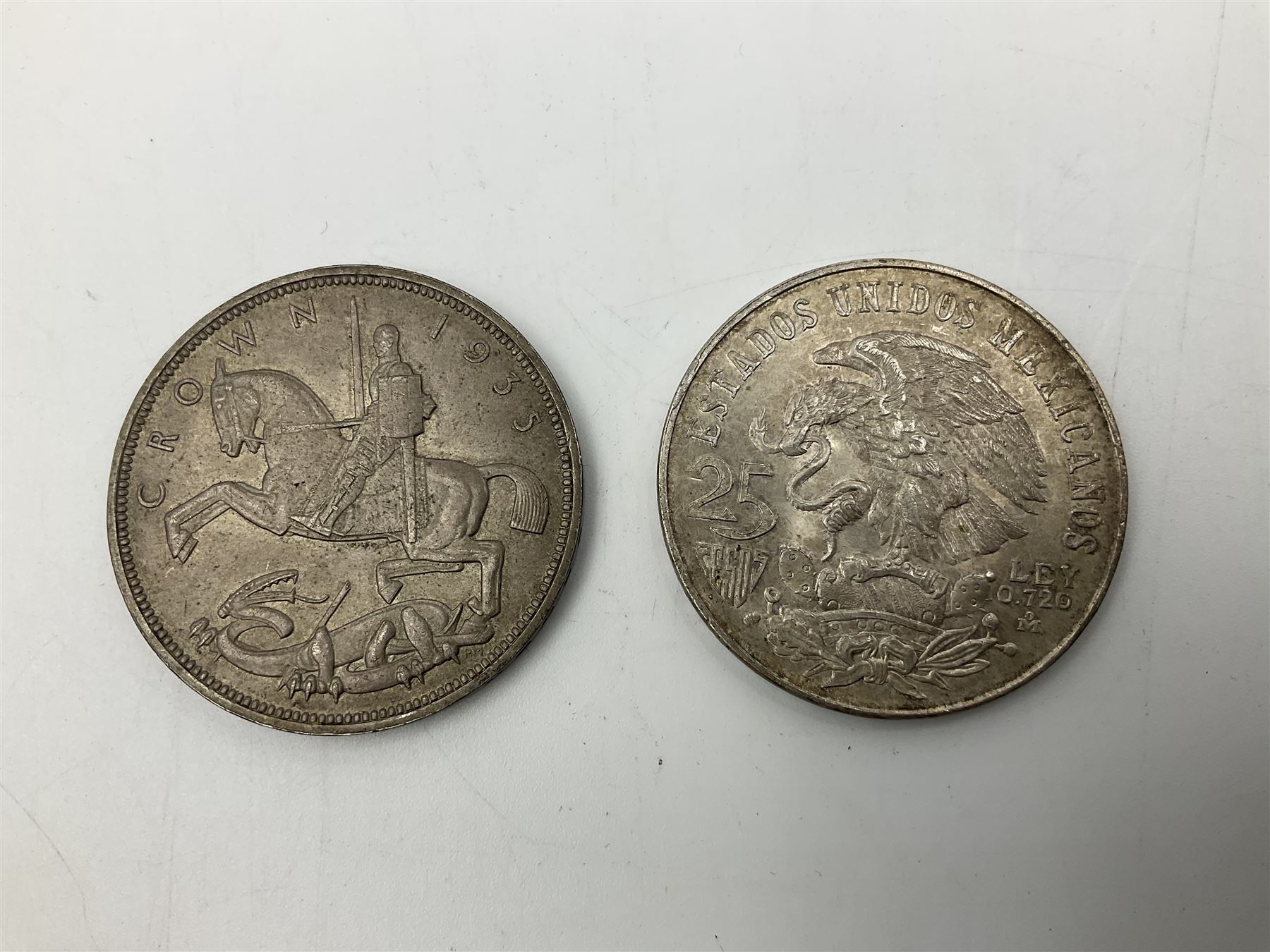 Two United States of America silver Morgan dollars dated 1885 O, 1888 O, King George V 1935 crown coin, and Mexico 1968 twenty-five pesos coin