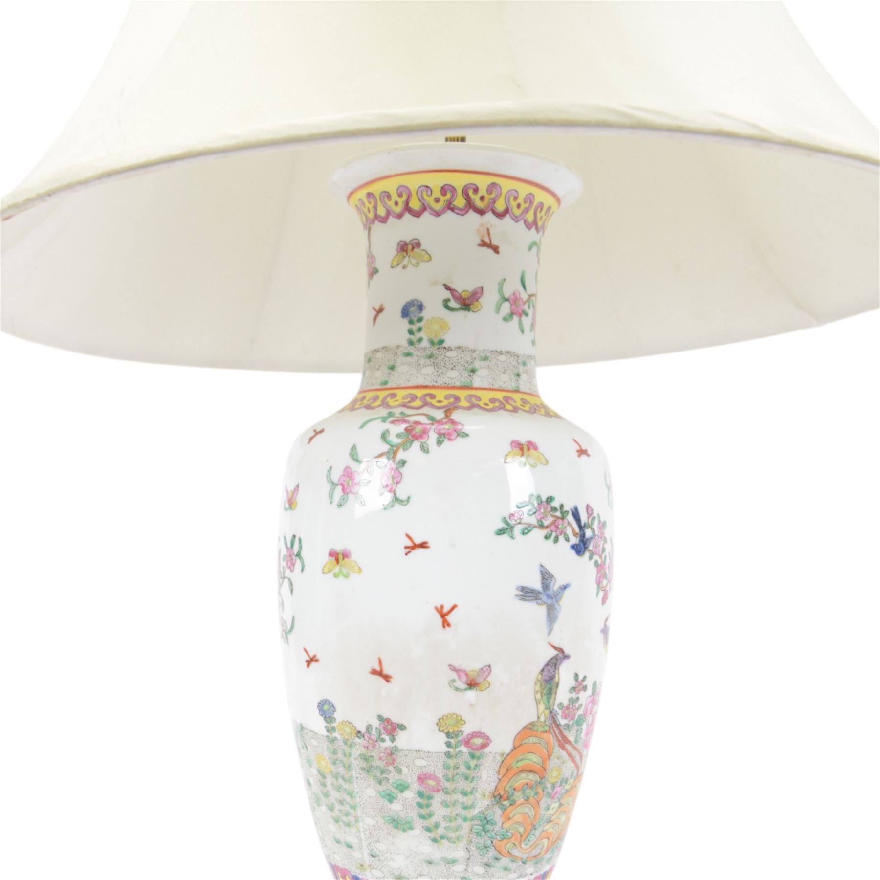 Chinese famille rose table lamp, of baluster form, decorated with birds in blossoming branches, upon a circular wooden base with shade, H78cm