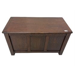 Early 20th century oak blanket box, carved frieze with panelled front