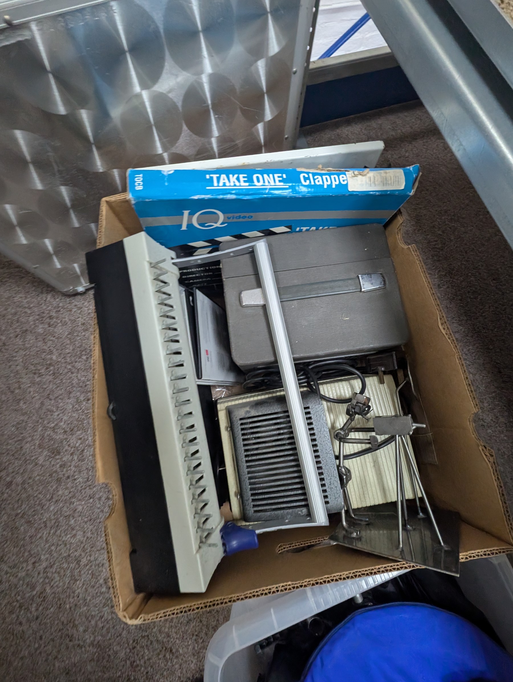 Collection of photography equipment, including cases, tripods, screens, guillotine, lighting etc