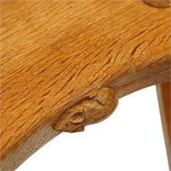 Mouseman - oak three-legged stool, dished kidney-shaped seat, raised on three octagonal splayed supports, with carved mouse signature, by the workshop of Robert Thompson of Kilburn