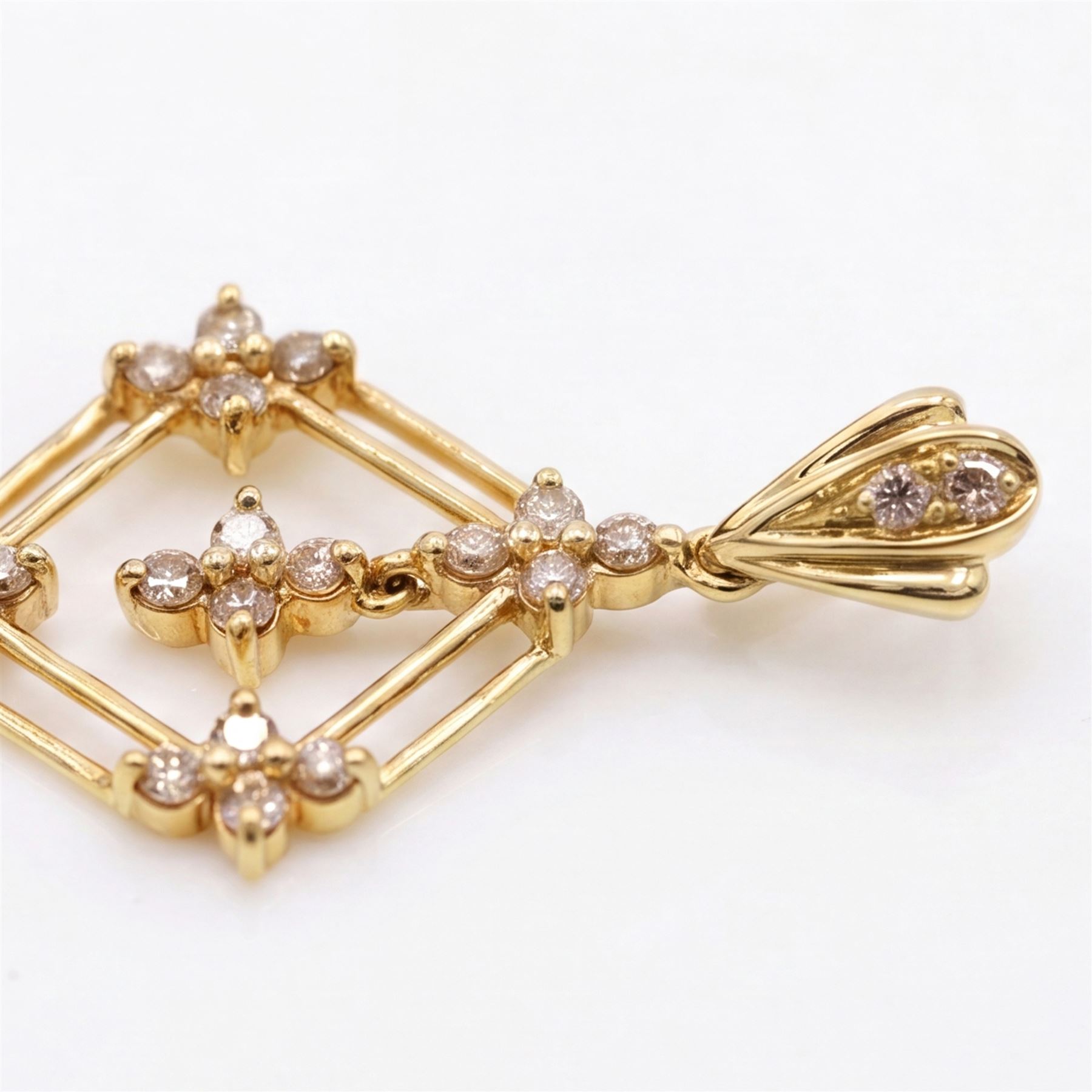 18ct gold diamond lozenge pendant, set with twenty round brilliant cut diamonds within an openwork frame, to a diamond set bale
