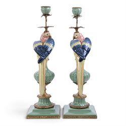 Pair candlesticks, modelled as parrots, upon urn shaped mounts with gilt detail, H48cm