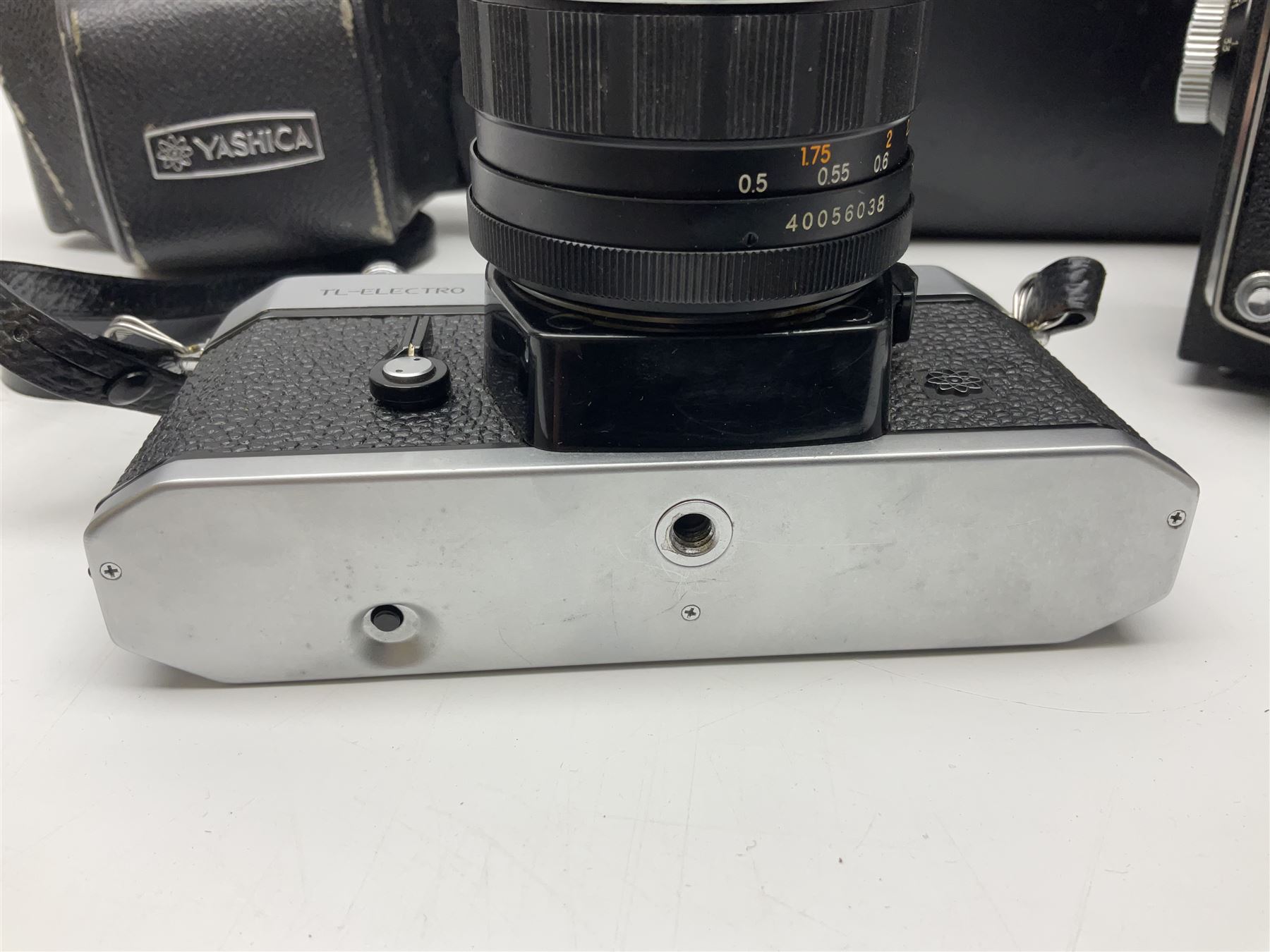 Yashica-A camera body, serial no. A4080073, with 'Yashikor 1:3.5 f=80mm' lens, serial no. 209272 and 'Yashikor 1:3.5f=80mm' lens, serial no 22942, together with Yashica TL-Electro camera body, serial no. 5054162 with 'Yashinon-DS 50mm 1:1.9  40056038