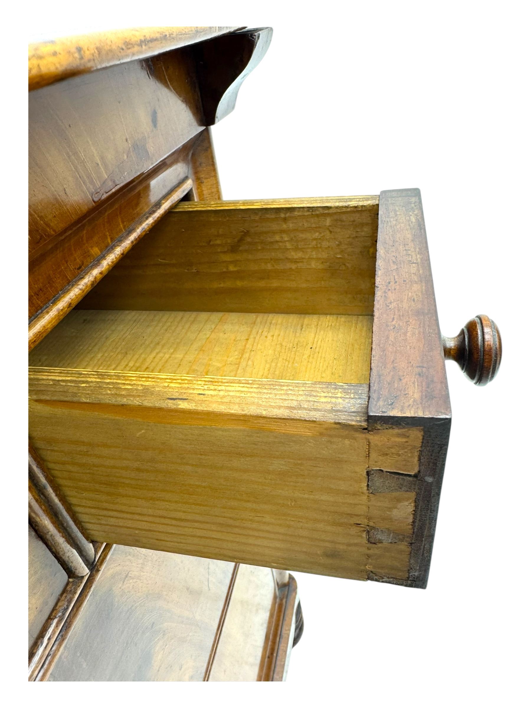 19th century French figured mahogany and walnut chest, rectangular top over three short and two long drawers, on turned feet