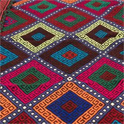 Afghan kilim runner rug, the field decorated with geometric patterned concentric lozenges in multicolours, the contrasting guard stripes with repeating chevron design
