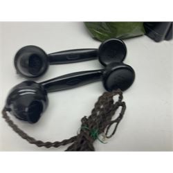 Collection of phone headsets, including GPO bakelite examples, together with other telephone parts 