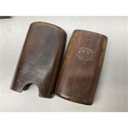 Victorian leather cigar protector with metal match striking plate on the end and internal spring to hold the cigars in place; expands for differing lengths of cigar, minimum L12.5cm; another similar leather cigar case marked Middlemore's Patent with attached vesta case and striker; three Bryant & Mays tin-late matchbox holders including 1935 Jubilee; and small box of matches (6)