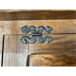 'Acornman' figured oak telephone table, panelled back above hinged seat and two drawers, panelled sides and front, all over adzing, by Alan Grainger of Brandsby, York