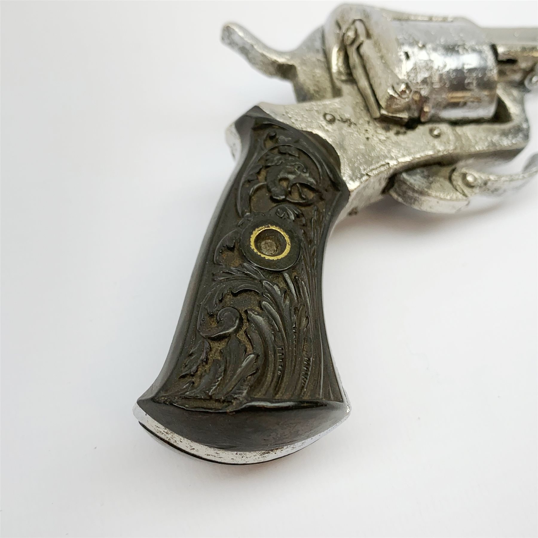 19th century plated Belgian 7mm pin-fire revolver, the six-shot cylinder inscribed 'The Young Lion 1881 New Pattern', with folding trigger and carved walnut split stock, barrel length 7.5cm, overall length 18.5cm