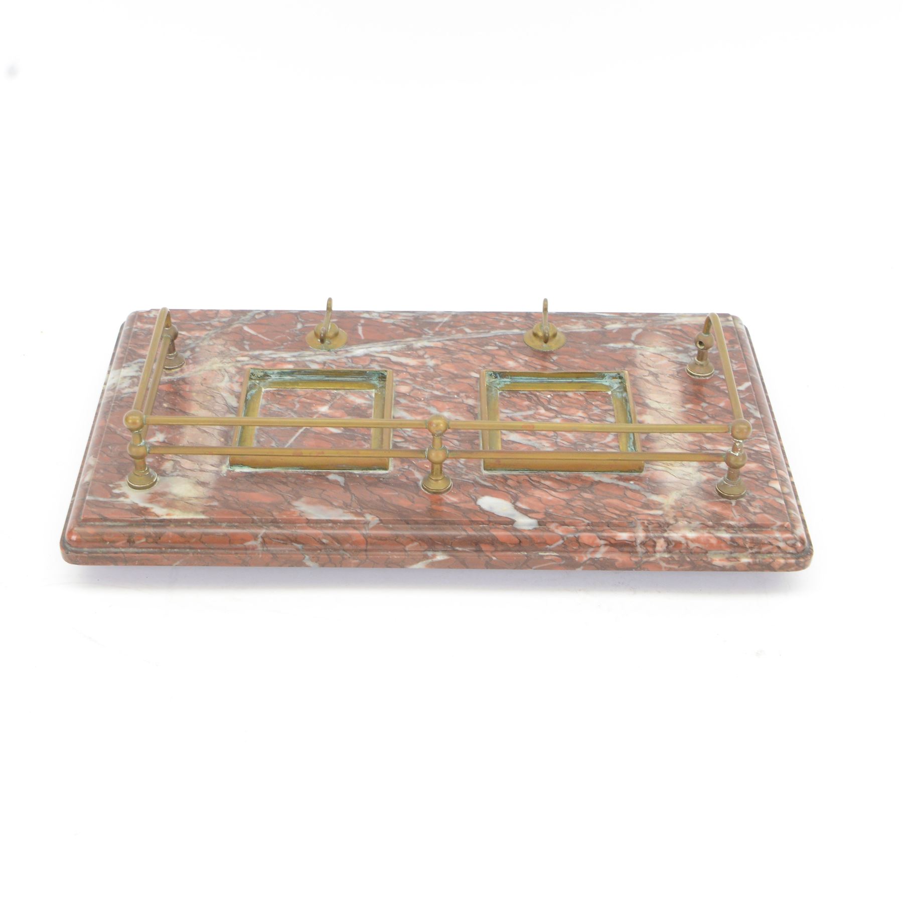 Victorian brass metal mounted red marble inkstand, the stepped rectangular base raised upon bun feet, complete with two glass ink bottles with hinged lids, H12cm