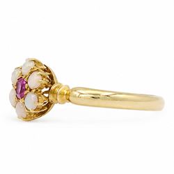 Edwardian 18ct gold ruby and opal flower head cluster ring, single oval cut ruby, surrounded by six round cut opals, Birmingham 1902, boxed
