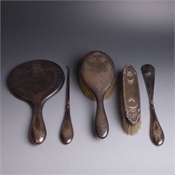 Early 20th Century silver mounted dressing table set, comprising hand mirror, shoe horn an...