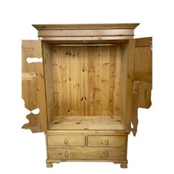 Traditional pine double wardrobe, fitted with two panelled doors over three drawers, on ogee feet