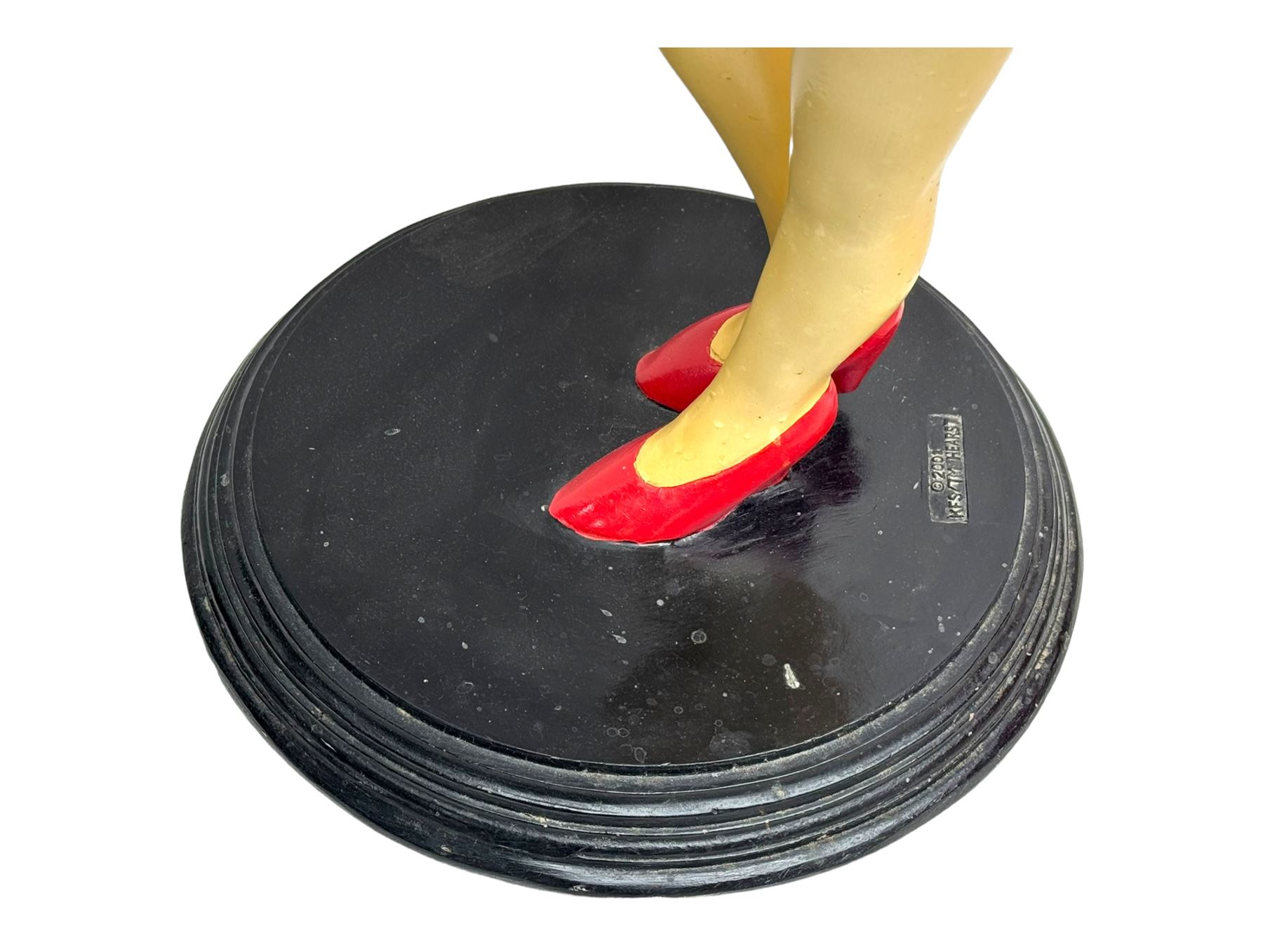Contemporary Betty Boop waitress figure, modelled standing with one hand holding a circular tray, dressed in a red dress with gold accents, on a black circular base