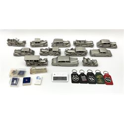 Twelve Danbury Mint pewter models of vehicles including Rolls Royce '1936 Park Ward Baby Rolls', Rolls Royce '1907 The Silver Ghost' etc and a small number of pin badges and car fobs