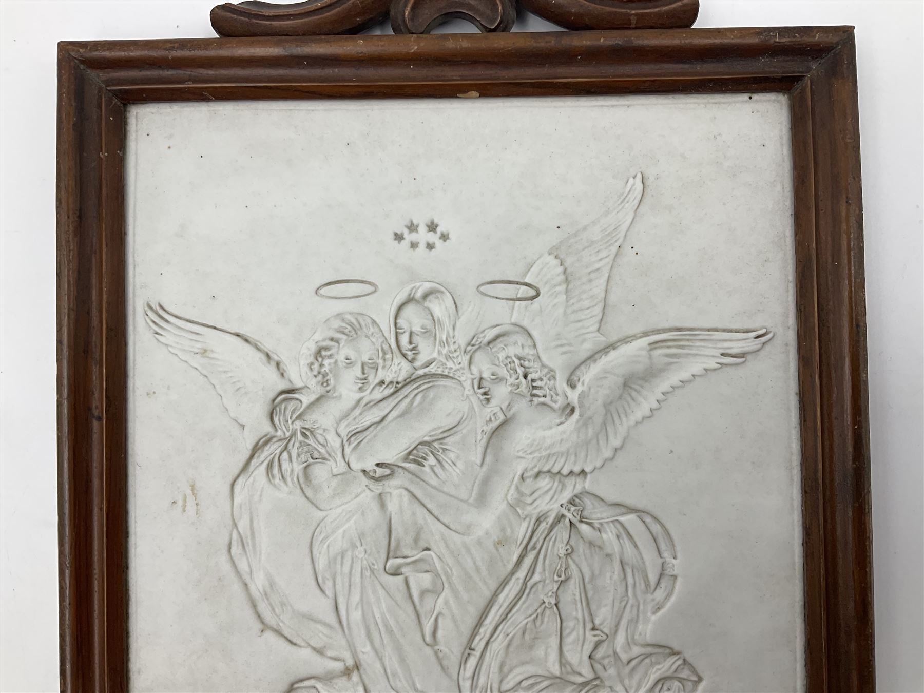 KPM Berlin lithophane panel, of two angels supporting a female figure to the centre, encased in a rosewood frame and handle, H42cm