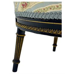19th century French ebonised low chair, upholstered in floral striped fabric within a moulded frame with gilt line and foliate decoration, the seat of serpentine form, raised on turned fluted legs with toupie feet