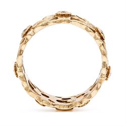 14ct rose gold diamond set band, pierced floral band set with seven round brilliant cut diamonds, stamped 14k