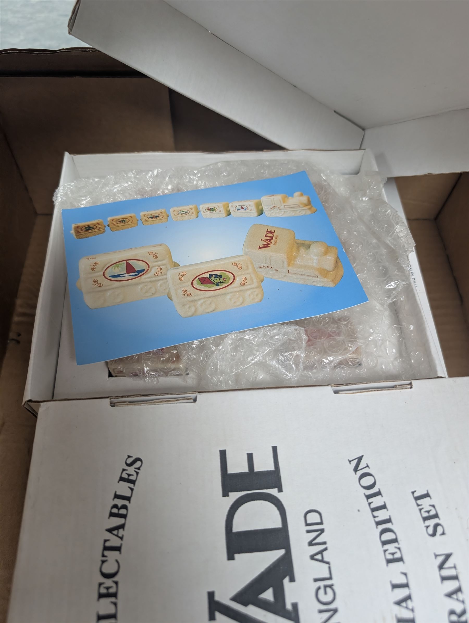 Eight boxed Wade Train Sets, including Autumn Train Gold, Winter Train Gold, Xmas Train 2002, Summer Train etc
