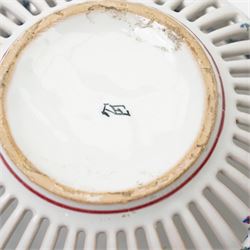 Two 20th century French faience openwork baskets, by Emile Tessier Malicorne, painted with polychromatic floral decoration, with scalloped rims, marked to base, larger 9cm (2)