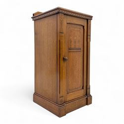 Art Nouveau oak bedside cabinet, rectangular top above a single door inlaid with stylised ...
