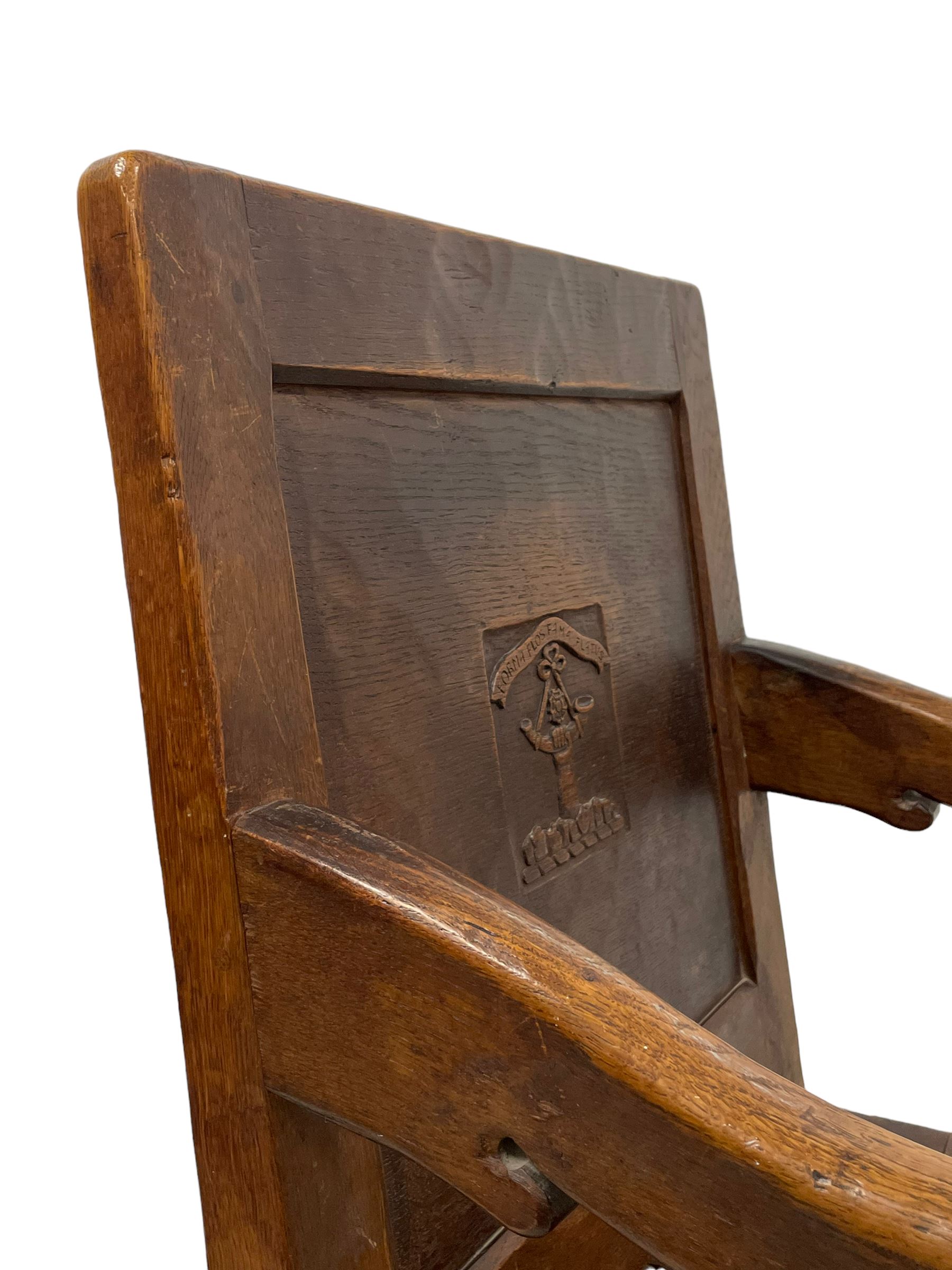 Mouseman - circa. 1930s set of six (4+2) oak dining chairs, panelled back carved with the Bagshawe family crest, the moto 'Forma Flos Fama Flatus' over an arm grasping a bugle-horn with ribbon tie and Yorkshire rose motif, adzed frame, leather lattice strap seat, on octagonal supports united by stretchers, two carvers and four side chairs, each carved with mouse signature, by Robert Thompson of Kilburn 

Provenance: Owned since manufacture by the Bagshawe family, descendants of the Staithes Group Artist Joseph Richard Bagshawe RBA (1870-1909).