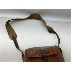 Fleece lined leather gun sling with former owners brass plaque L117cm,  leather jerkin, two leather cartridge bags, leather 12-bore cartridge belt and two-piece gun cleaning rod