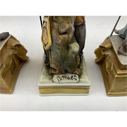 Group of seven Capodimonte figures of soldiers, to include four Bruno-Merli examples including Officer of the 12th Lancers 1820 and Captain of the 18th Hussars 1815, both raised upon ornate gilt plinths bearing British monarch motto in Latin 'Dieu et mon droit', and three further similar, all with crowned N mark beneath, tallest H32cm