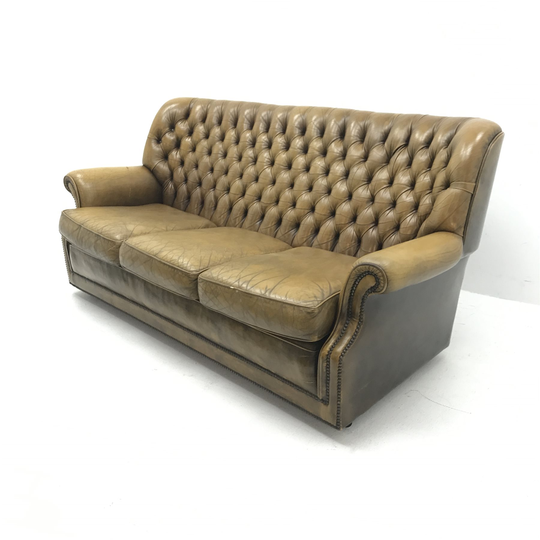 Pegasus three seat sofa upholstered in deeply buttoned antique brown leather, W185cm
