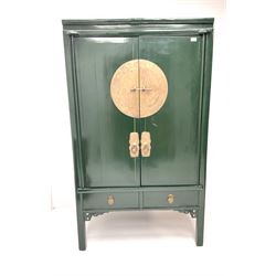 Chinese 'moon' rosewood raised cabinet, hammered brass centre piece featuring floral design, two cupboard doors enclosing two tiers and two short drawers, above two short drawers, shaped trim and stile supports 