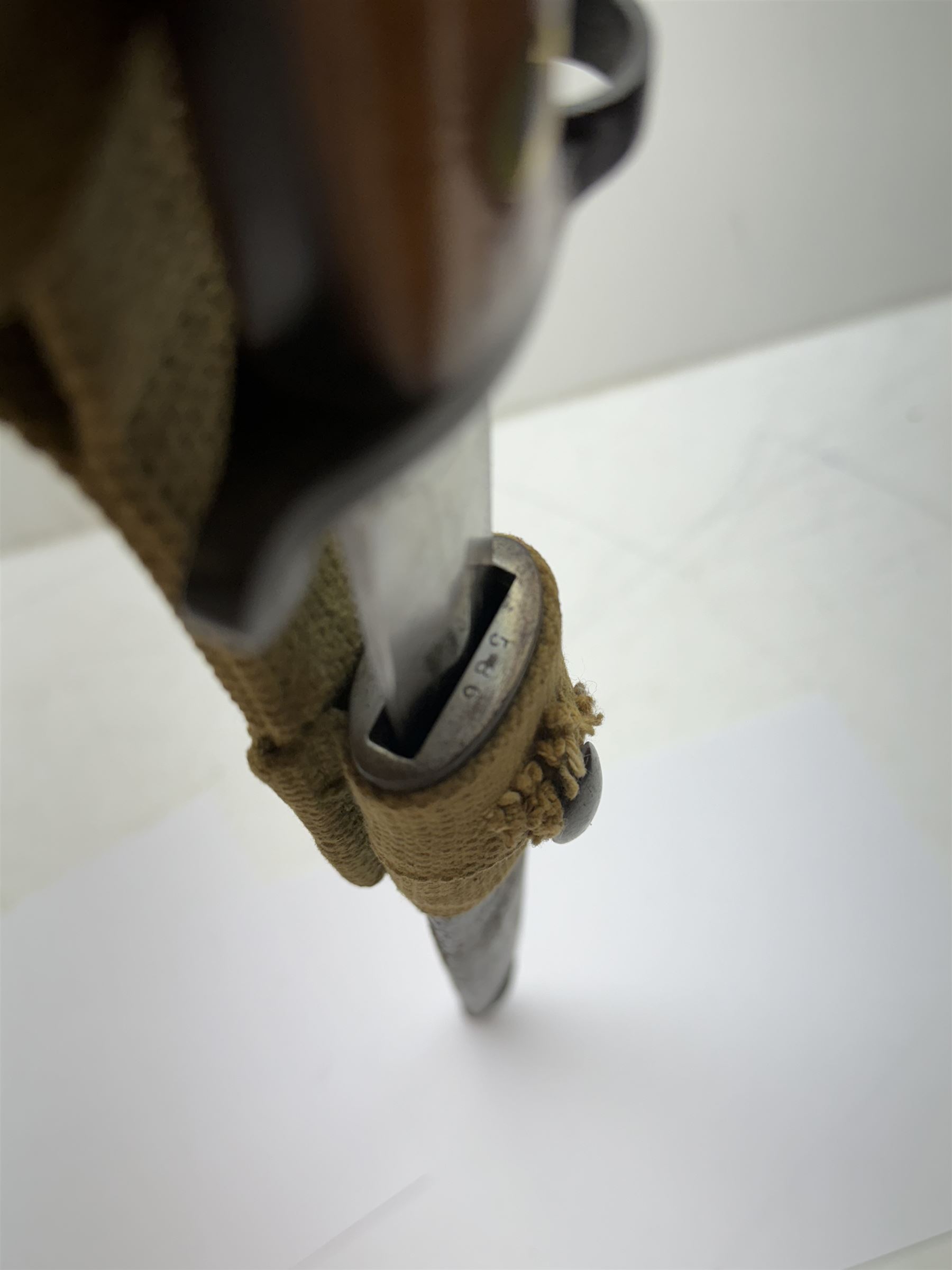 WWII Lee Metford rifle bayonet with original scabbard marked 586, with canvas frog, L44cm overall 
Notes; due to the condition of the bayonet it is possible this was issued to the home guard