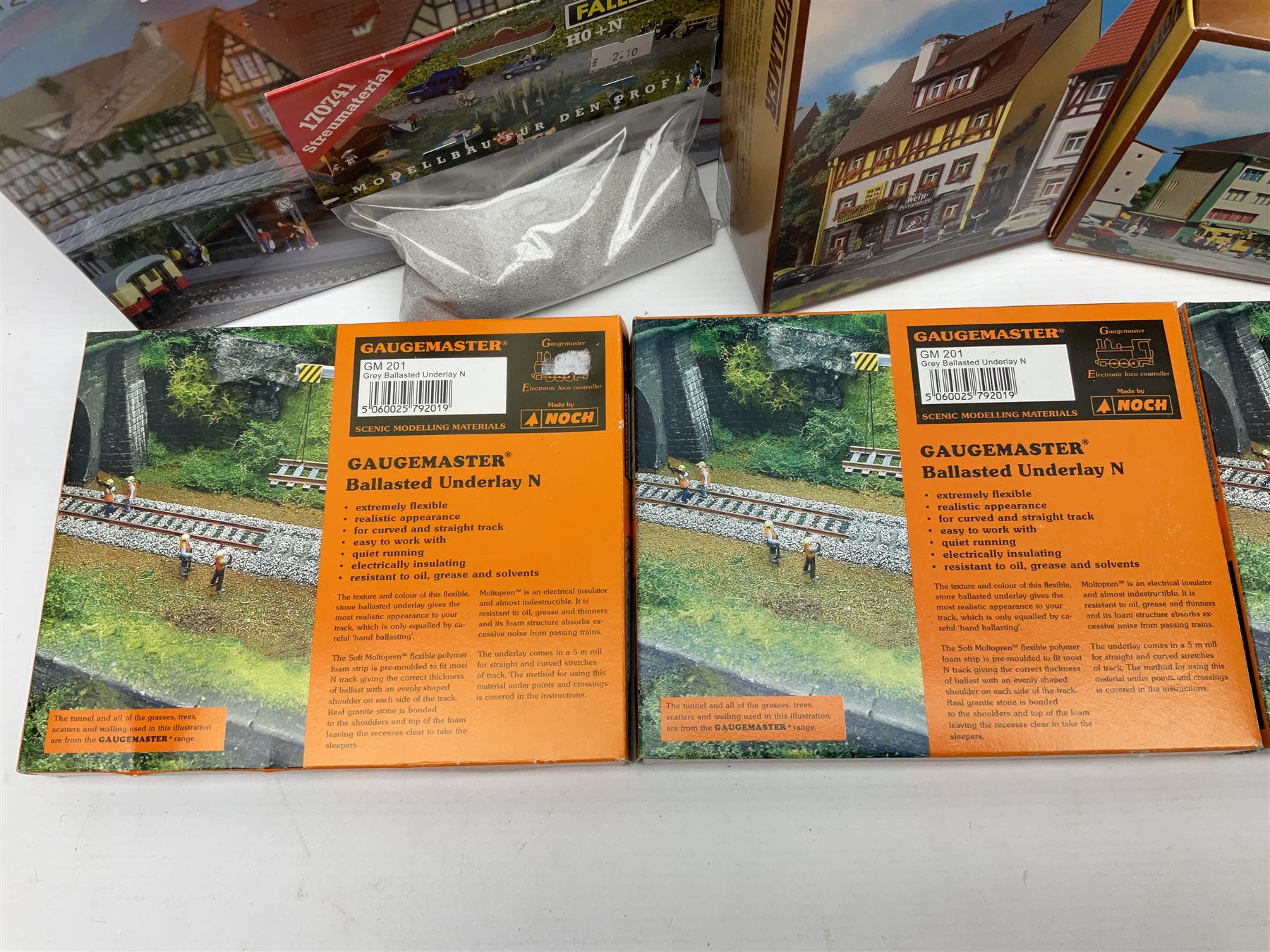 'N' gauge trackside accessories - seven Faller buildings and bridges etc Nos.N212113, N222121, N222583, N222174, N222128, Z282730 & Z282707; two others by Vollmer Nos.N7657 & N7724; four boxes of Gaugemaster Ballasted Underlay; grit and Foliage Clusters