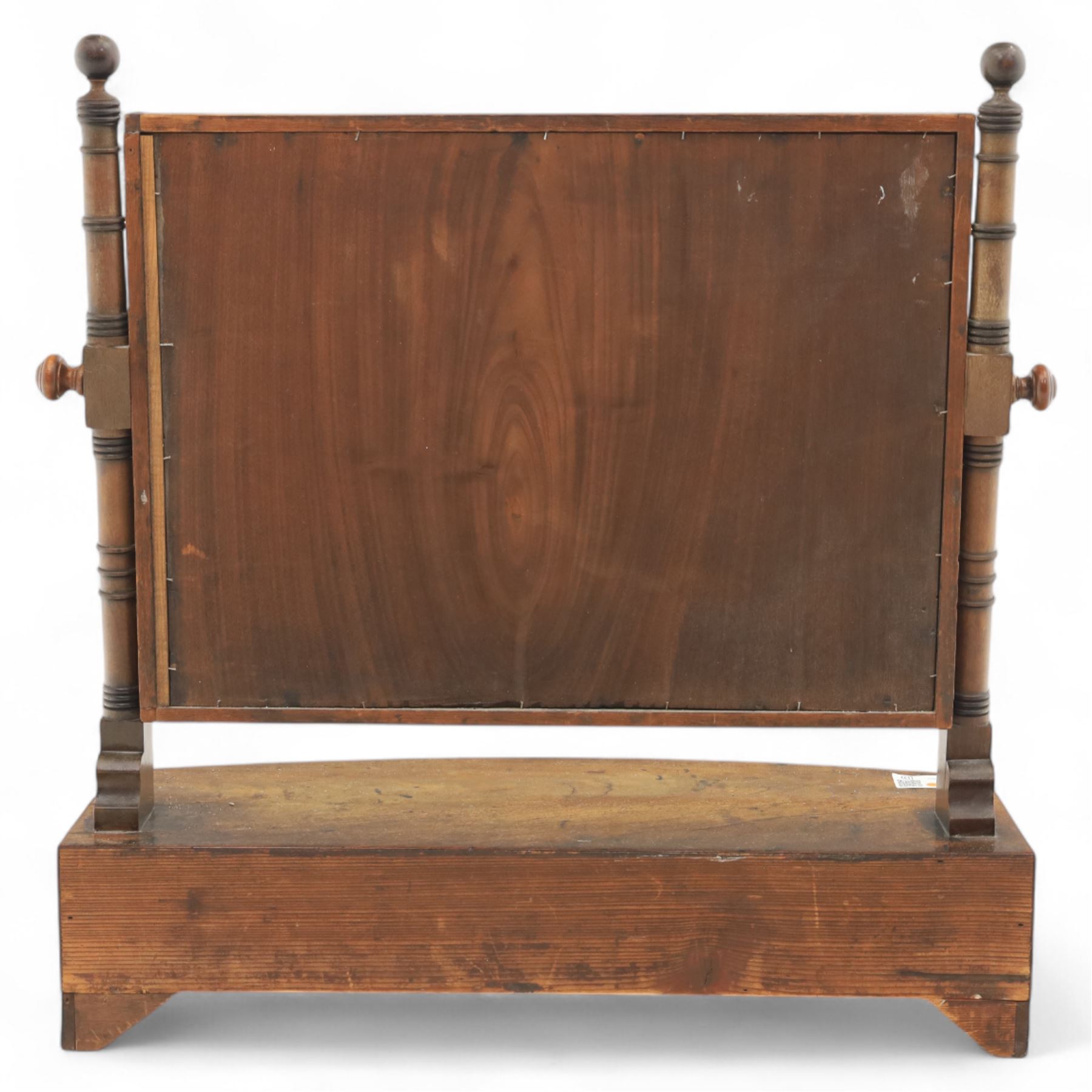 19th century mahogany swing mirror, rectangular frame on turned supports with ball finials, bow front base fitted with three drawers and ebony knob handles, raised on shaped feet