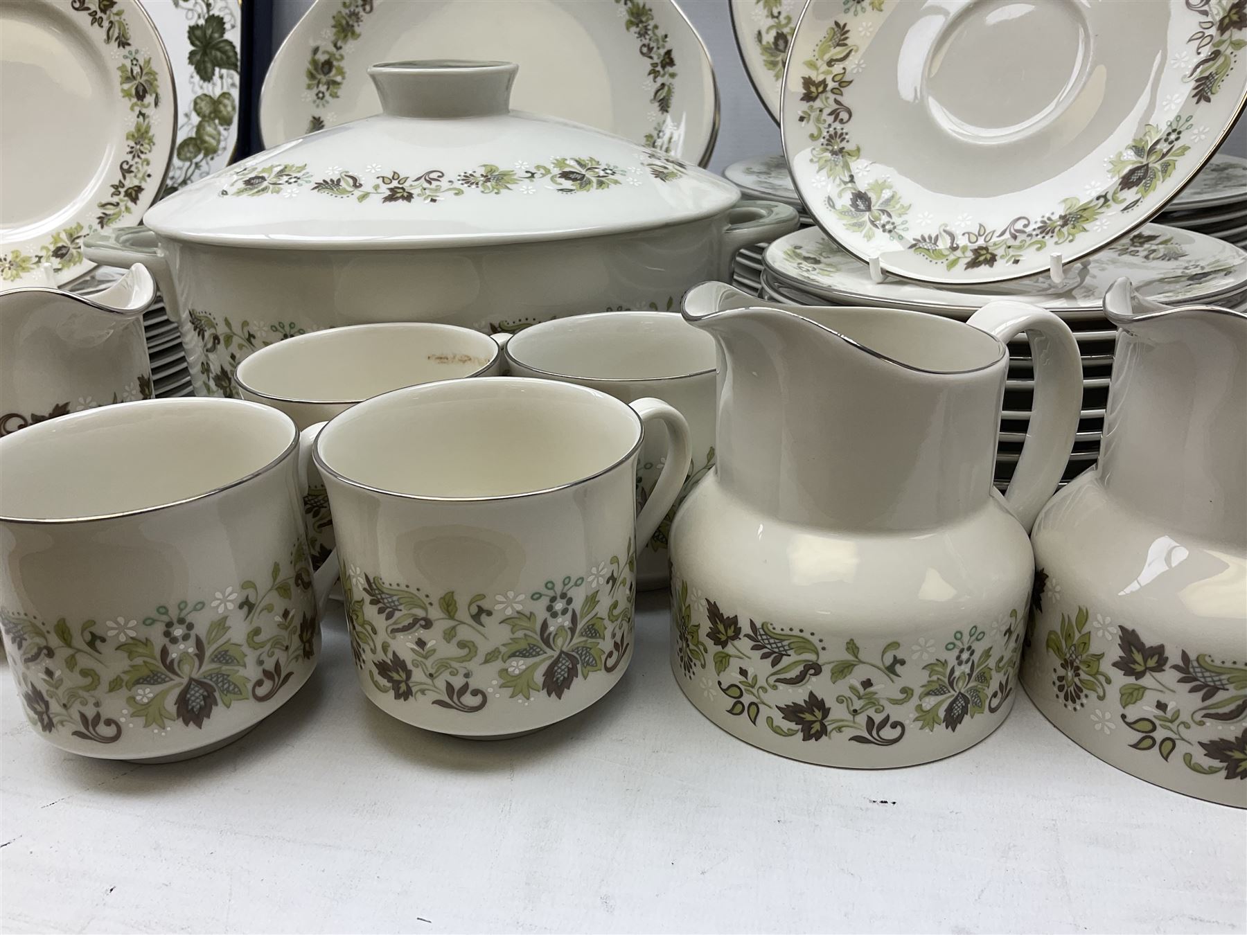 Royal Doulton tea and dinner wares decorated in the Vanity Fair pattern, to include twelve dinner plates, twelve side plates, eleven bowls, three lidded tureens, ten teacups, sauceboat on stand etc, together with boxed Royal Worcester plate, six Royal Worcester ramekins etc