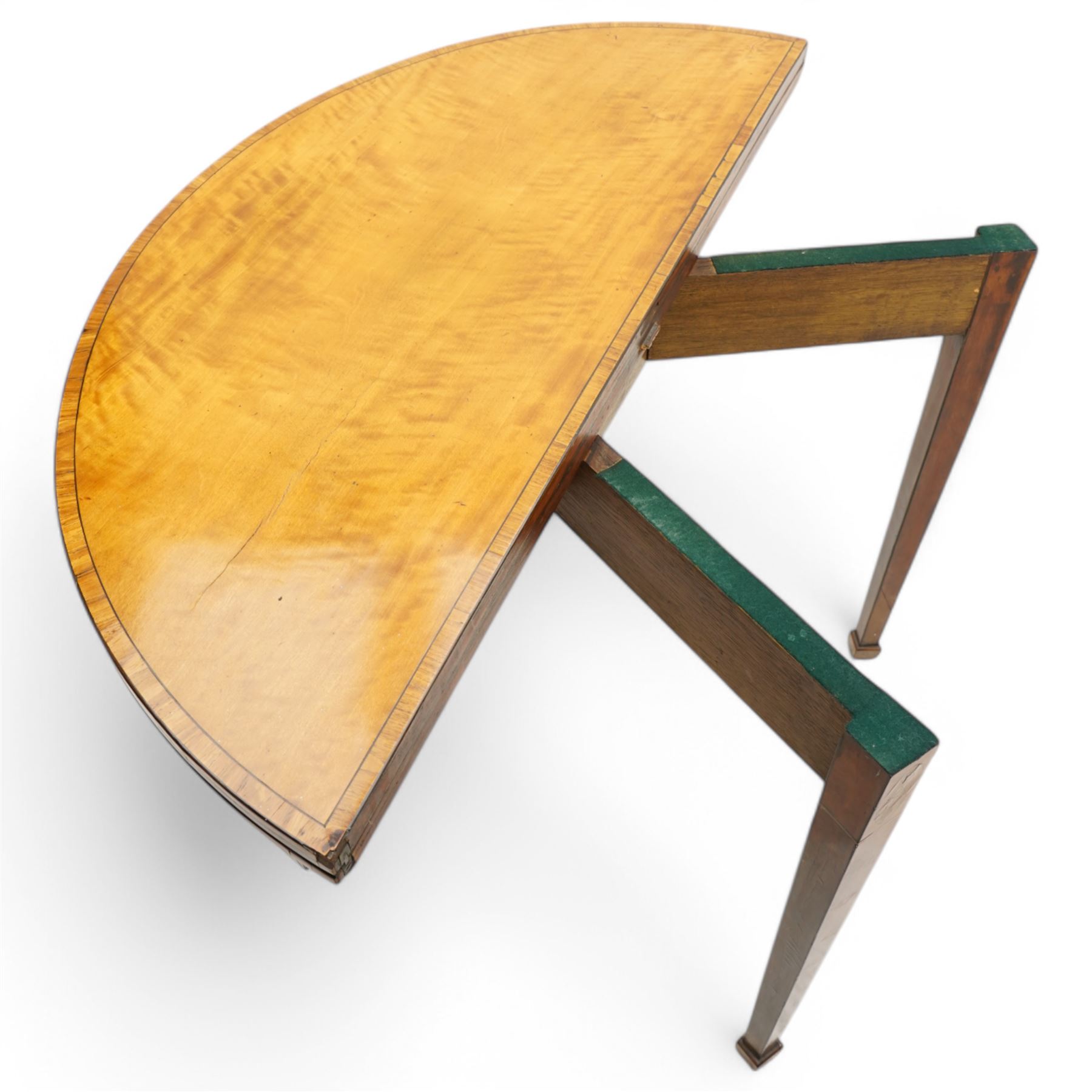 George III satinwood demi-lune tea table, fold-over top over double-gate leg action base, the central frieze rails and support headers inlaid with floral marquetry panels, on square tapering supports and block feet 
